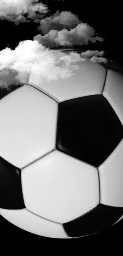 Black and white soccer ball with clouds on mobile wallpaper.