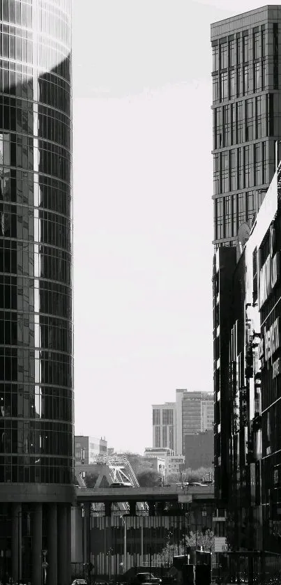 Black and white wallpaper of city skyscrapers.