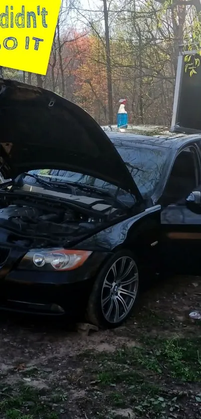 Black car with open hood in outdoor setting, DIY repair scene.