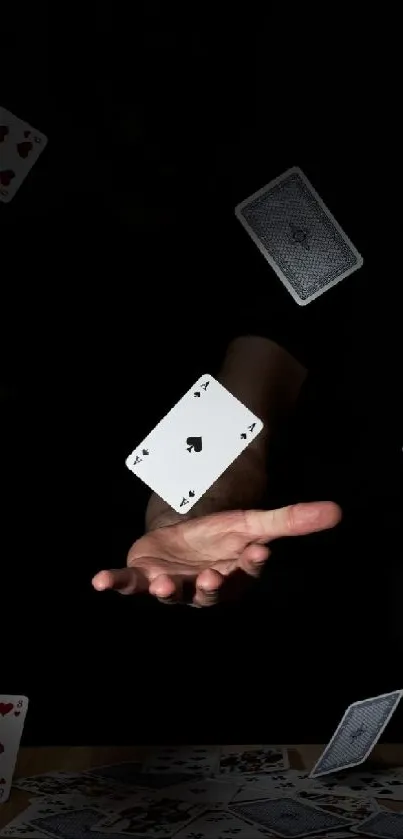 Magical scene of floating playing cards with a mysterious hand.