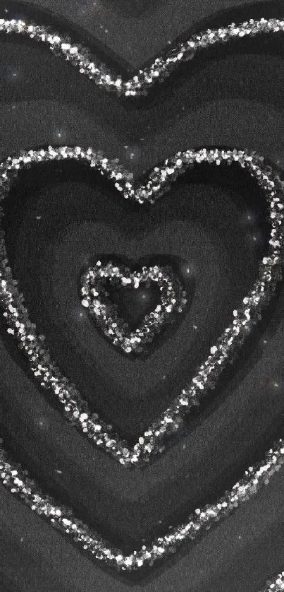 Black wallpaper with glitter hearts design.