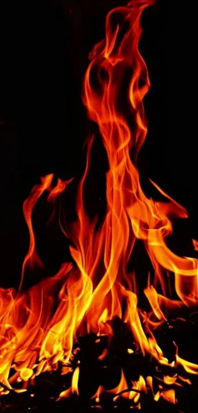 Vibrant orange flames on a dark background mobile wallpaper.