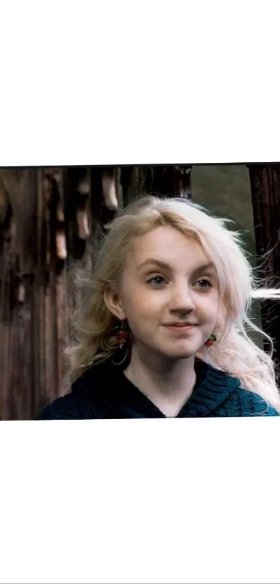 Blonde girl in rustic wooden background, serene expression.