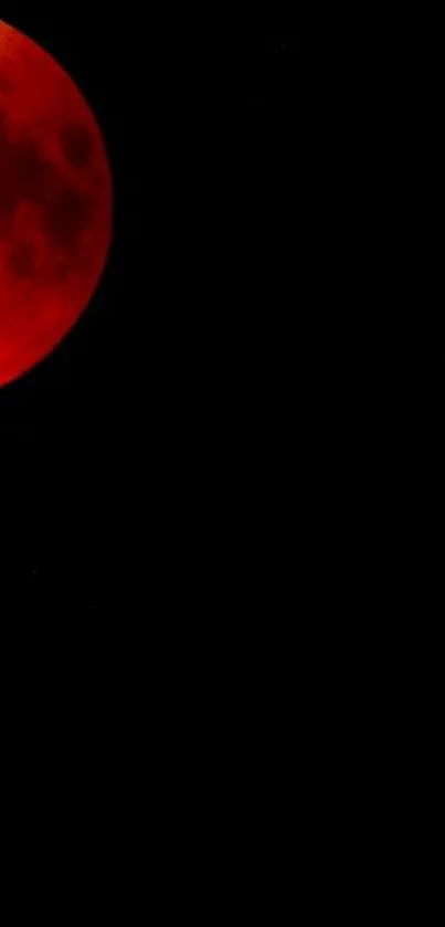 Blood moon glowing against a black sky, creating a celestial ambiance.