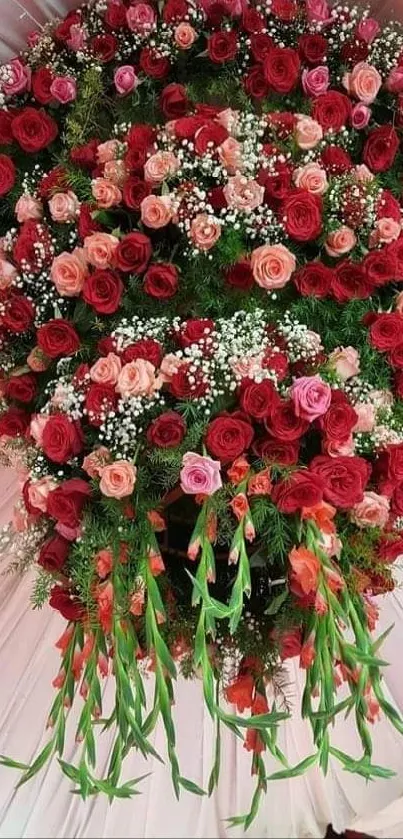 Vibrant bouquet of red roses with greenery.