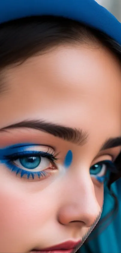 Close-up portrait with blue eye makeup and vibrant colors.