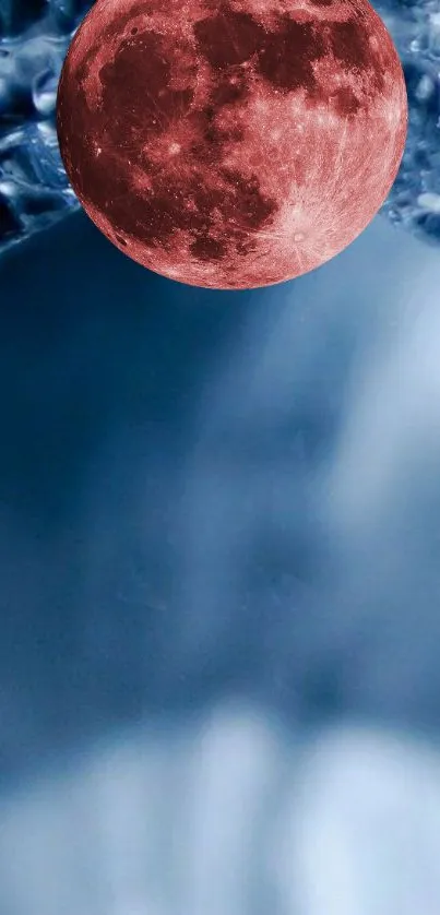 Red moon in blue sky wallpaper, cosmic and serene design.