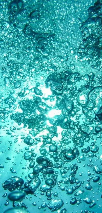 Sparkling blue bubbles underwater with sunlight shining through.