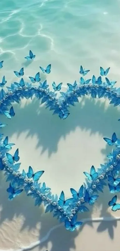 Heart made of blue butterflies on sandy beach