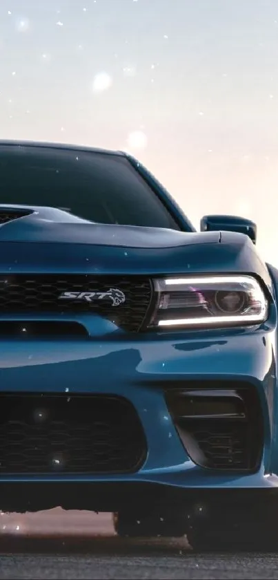 Sleek blue car front view at sunset.