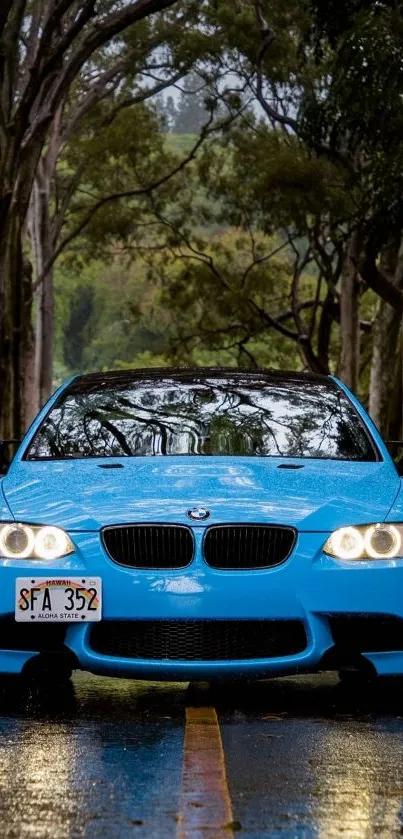 Blue car driving on wet forest road in rain.