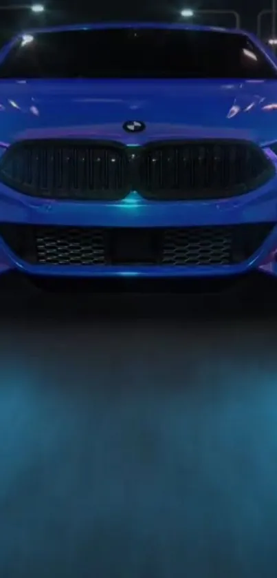 Sleek blue car with glowing lights on a nighttime road.