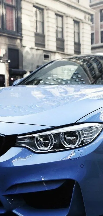 Sleek blue car parked in an urban setting with a reflective cityscape.