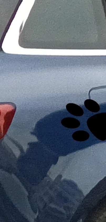 Blue car with a black paw print design, perfect for phone wallpaper.