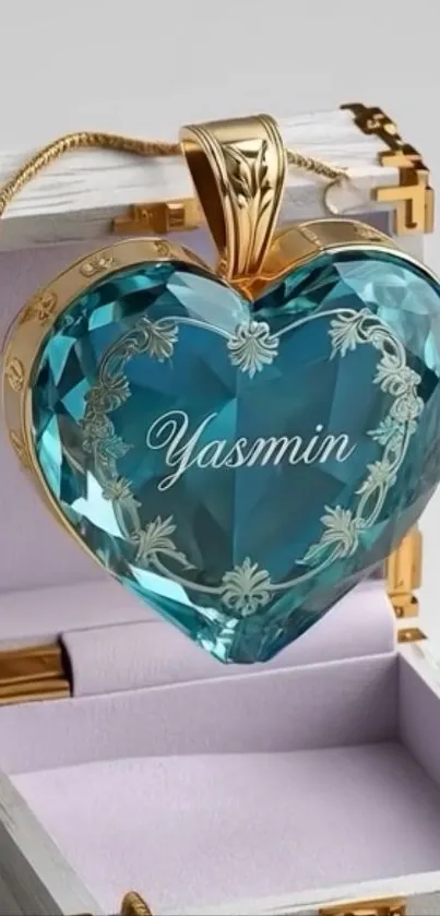 Blue crystal heart pendant with gold detailing.