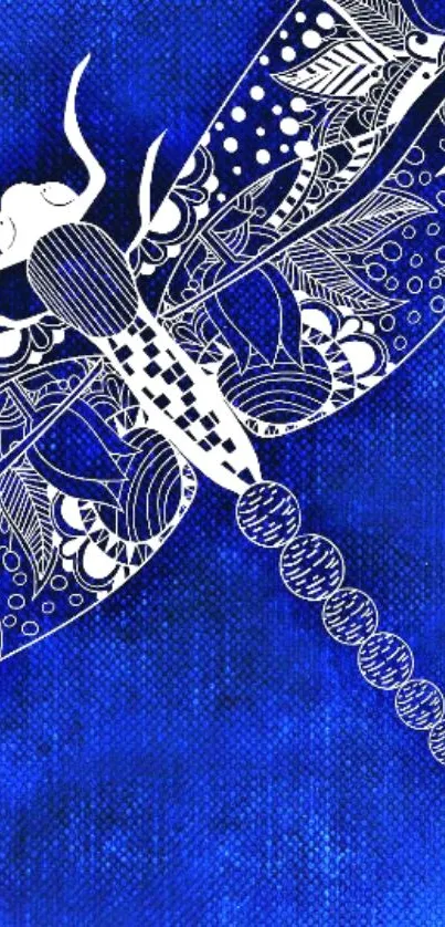 Intricate dragonfly on royal blue background.