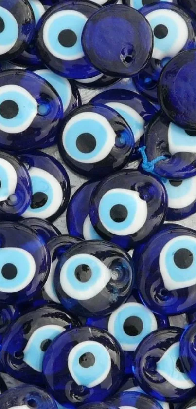 Blue evil eye charms wallpaper for mobile devices.