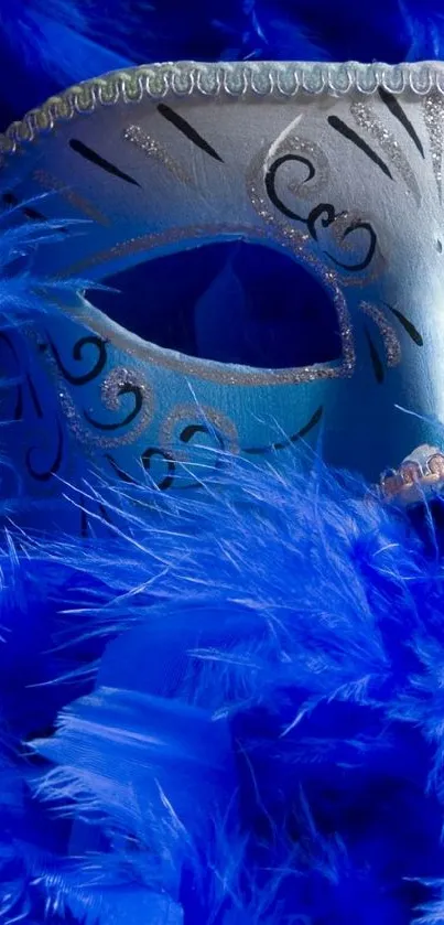 A vibrant blue wallpaper featuring a masquerade mask and feathers.