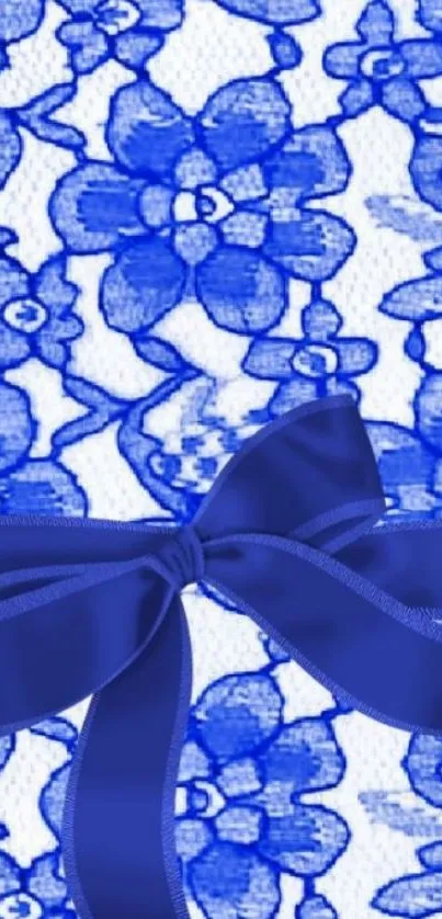 Elegant blue floral wallpaper with bow design.