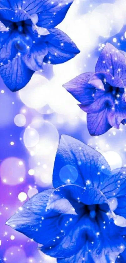 Blue flowers with sparkling bokeh effect wallpaper.