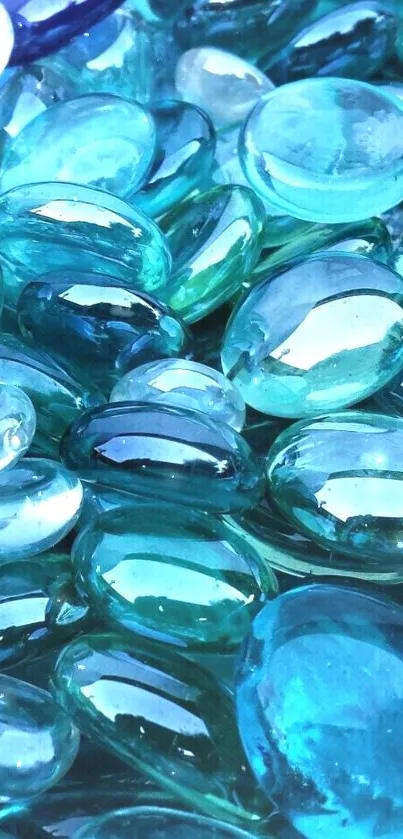 A collection of blue glass beads creating a calming phone wallpaper.