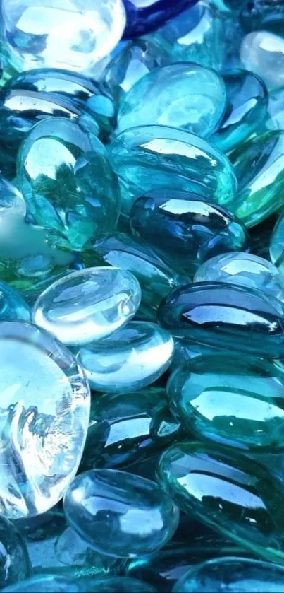 Close-up of blue glass pebbles forming a smooth, colorful texture.