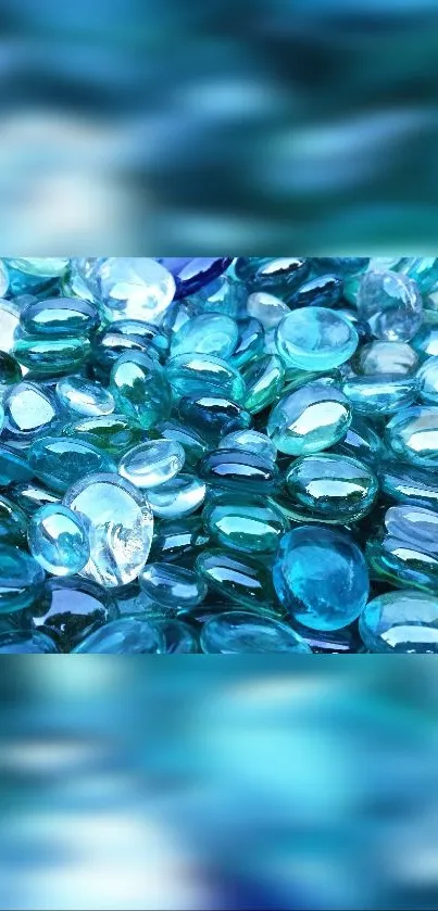 Vibrant blue glass pebbles creating a calming phone wallpaper background.