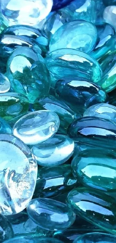 Blue glass pebbles create a serene aquatic theme for mobile wallpaper.