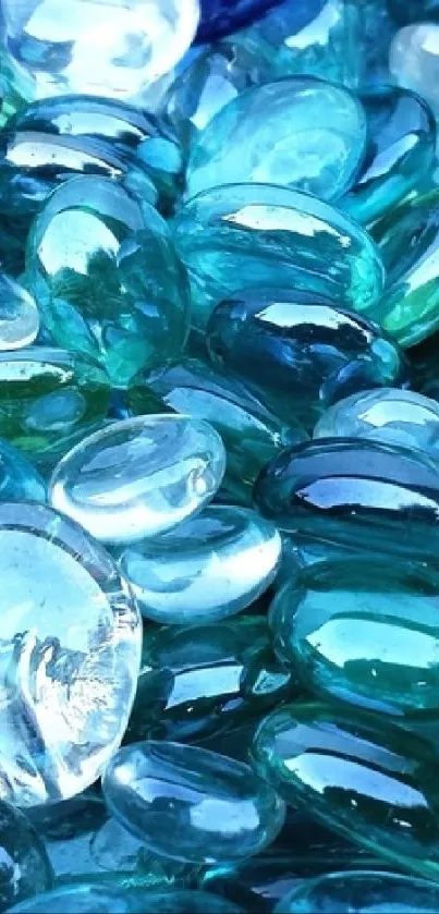 A collection of blue glass pebbles creating an elegant mobile wallpaper.