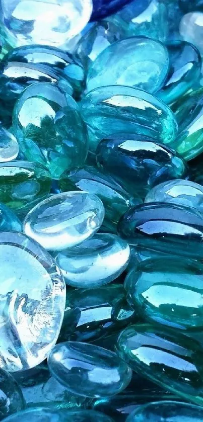 Blue glass pebbles creating a vibrant and calming phone wallpaper.