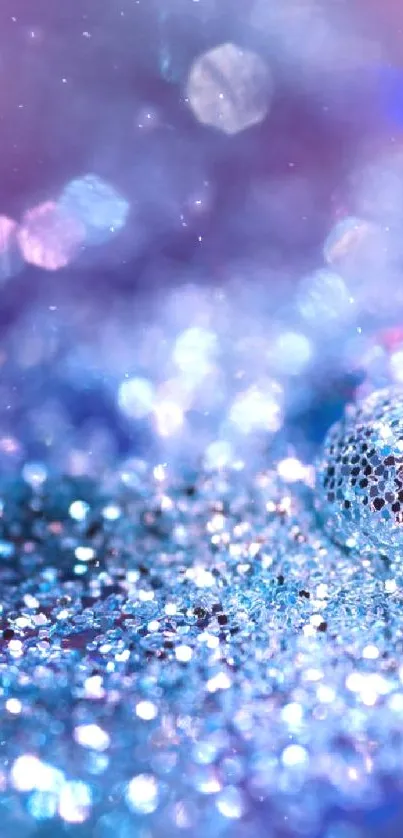 Blue glitter sparkle wallpaper with bokeh effect.