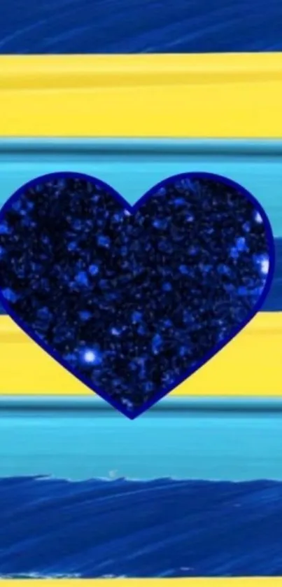 Blue glitter heart on yellow and blue striped background.