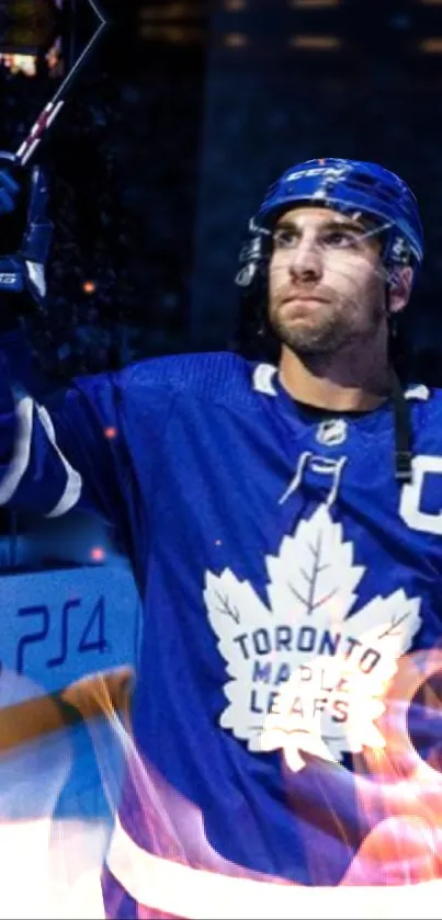 Hockey player in blue uniform with stick on ice rink wallpaper.