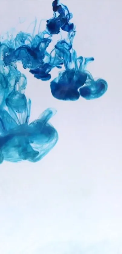 Vibrant blue ink swirling in fluid motion against a light backdrop.