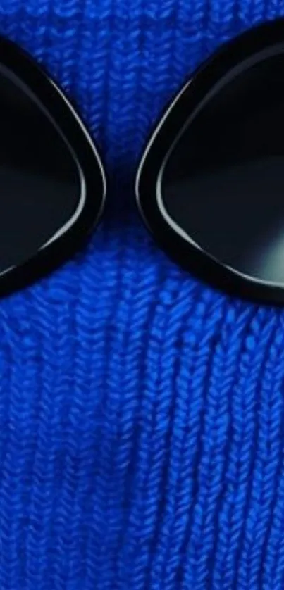 Blue knit texture with black sunglasses wallpaper.