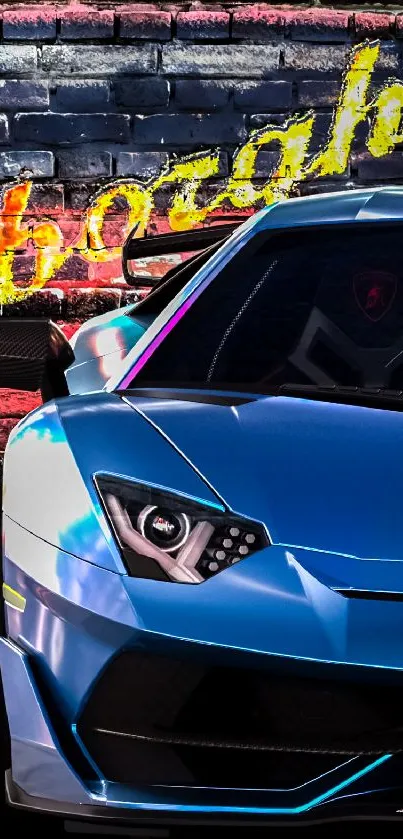 Blue Lamborghini in front of graffiti brick wall.