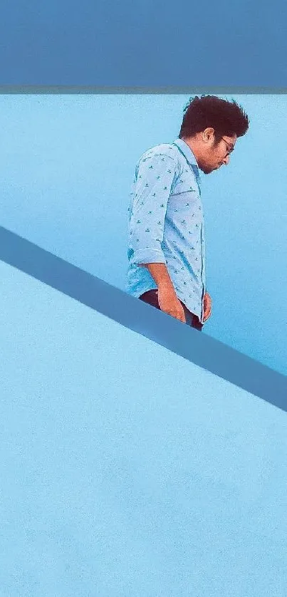 Minimalist blue wallpaper with a person for mobile phone.
