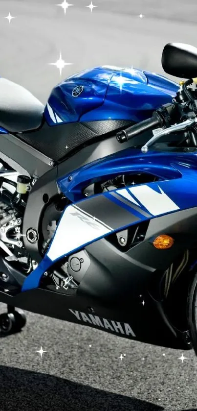 Vibrant blue motorcycle on a road, sleek and racing-ready.