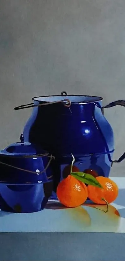 Still life with blue pots and oranges on a table in vibrant colors.