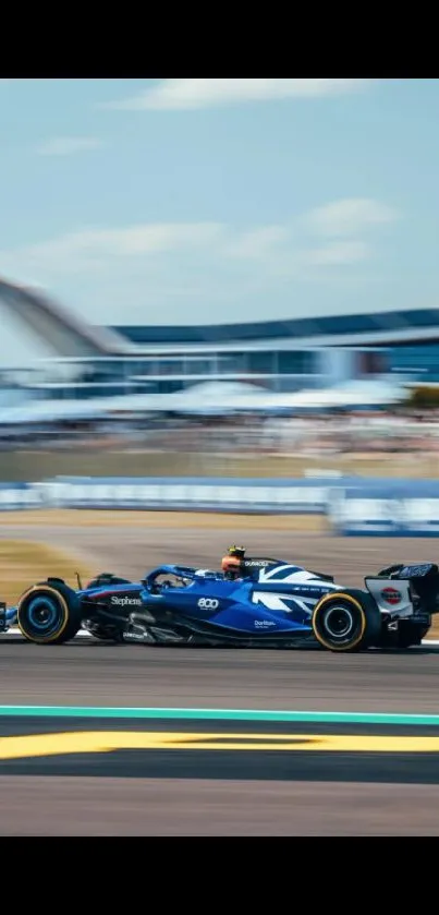 Blue racing car speeding on track wallpaper.