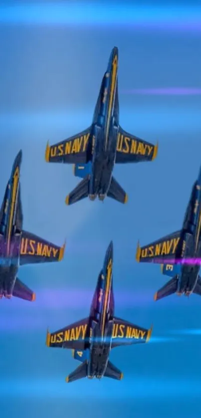 Four U.S. Navy jets in formation against a deep blue sky.