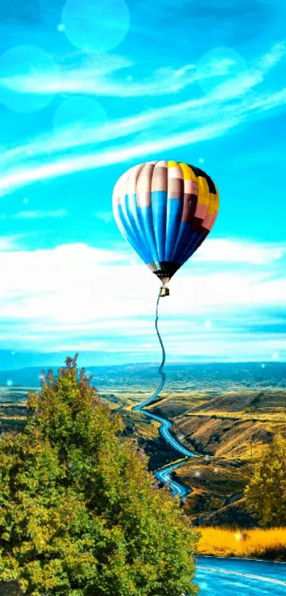 Colorful hot air balloon soaring under a bright blue sky.