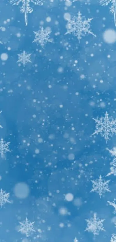 Blue snowflake wallpaper with frosty, winter theme and cold hues.