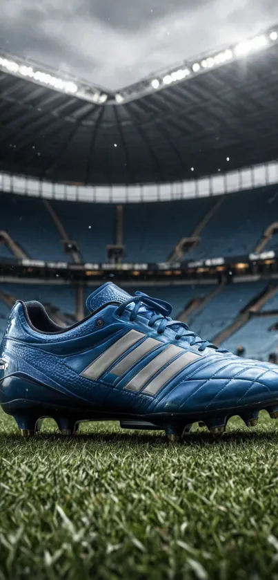 Blue soccer cleat on green field with stadium backdrop.