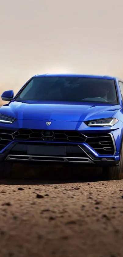 Blue sports car driving on a dusty road.