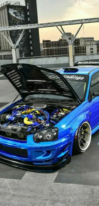 Vibrant blue sports car with open hood in urban setting.