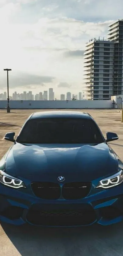 Blue sports car under a city skyline.