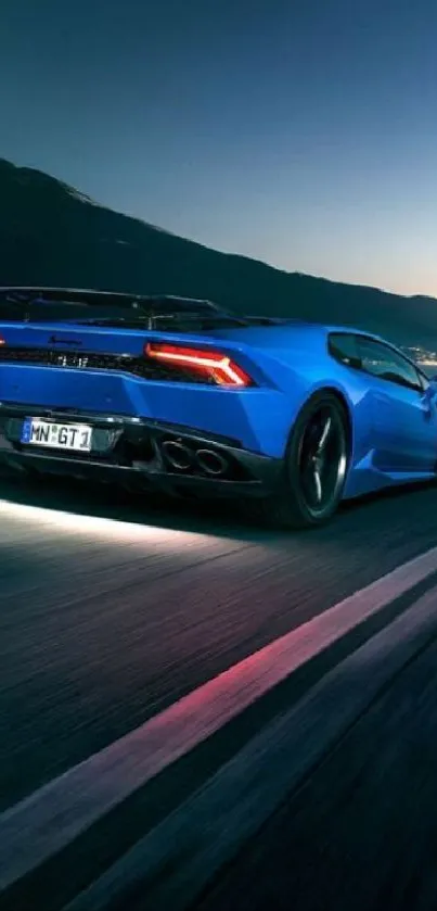 Dynamic blue sports car on a night drive, showcasing speed and elegance.