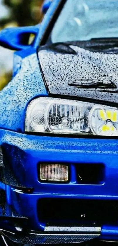 Close-up of a blue sports car with sleek, glossy details for wallpaper use.