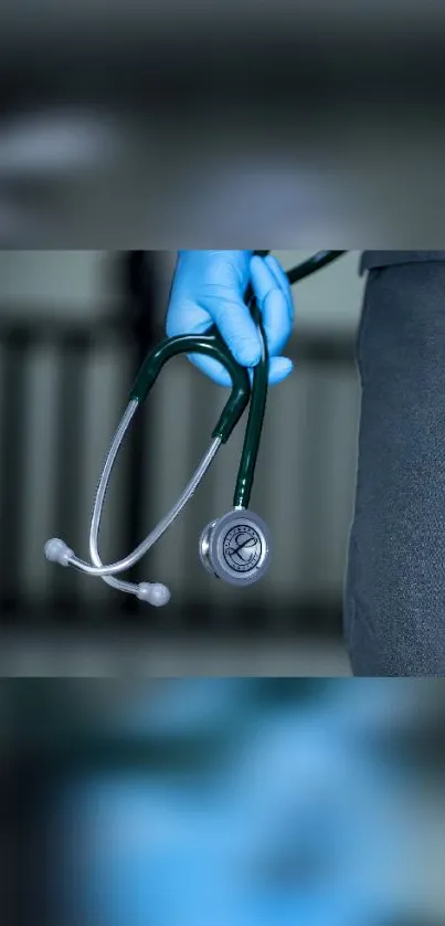 Blue stethoscope held by gloved hand for medical wallpaper.